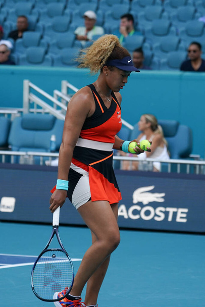 MIAMI GARDENS, FLORIDA - MARCH 31, 2022: Grand Slam Champion Naomi Osaka of Japan in action during her semifinal match at 2022 Miami Open at the Hard Rock Stadium in Miami Gardens, Florida - Fotó, kép