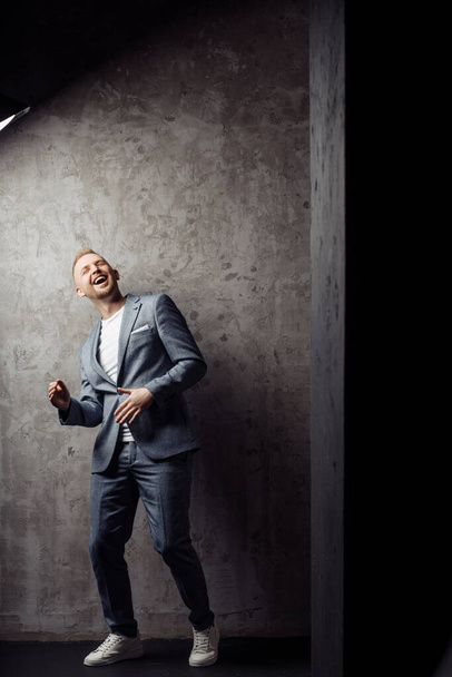 Full length body size photo of cheerful laughing happy man wearing classic grey suit spending free time - Photo, Image