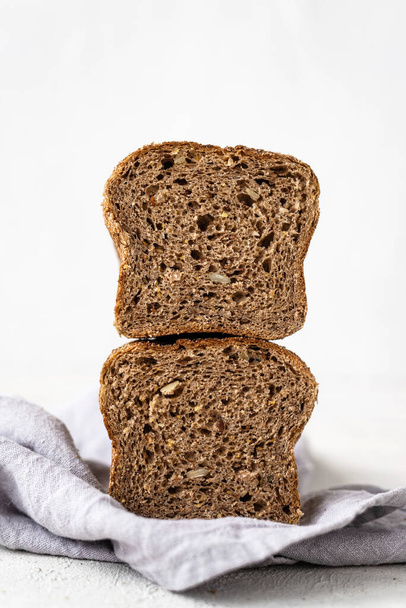 Fresh homemade bread on a white background. Bread texture. Bread on the table - Foto, imagen