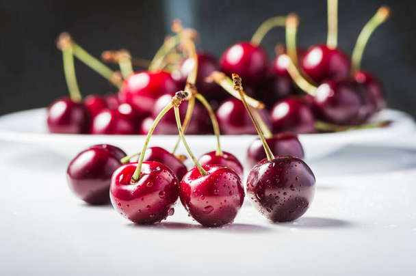 Delicious red cherry berries on the table. - Foto, Imagem