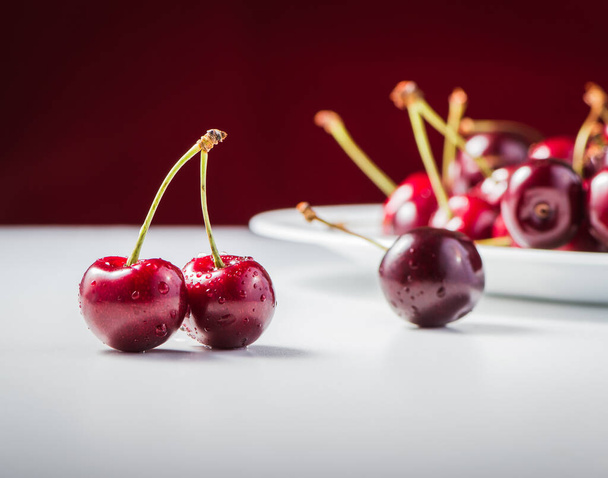 Delicious red cherry berries on the table. - Foto, Imagem