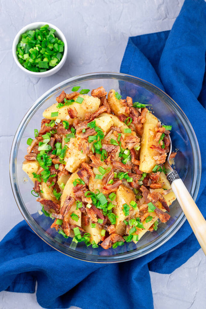 Bacon and onion potato salad dressed with apple cider vinegar and mustard, vertical, top view - Фото, изображение