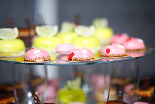 Wedding candy bar decoration setup with delicious cakes and sweets - 写真・画像