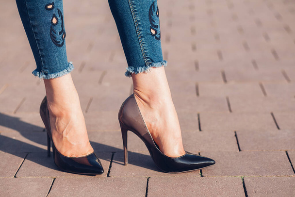 Woman in black high-heels. Closeup of female legs in high heels - Foto, imagen