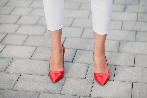 Woman in red high-heels. Closeup of female legs in high heels - Foto, Imagem