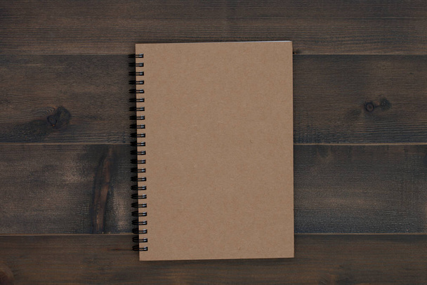 brown notebook on wooden table - Photo, Image