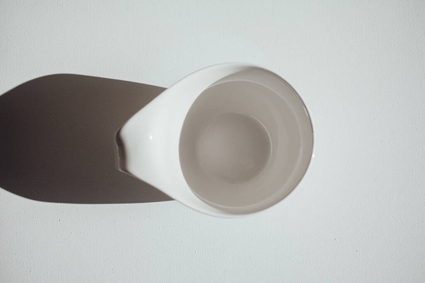 White mug isolated on a white background - Фото, изображение