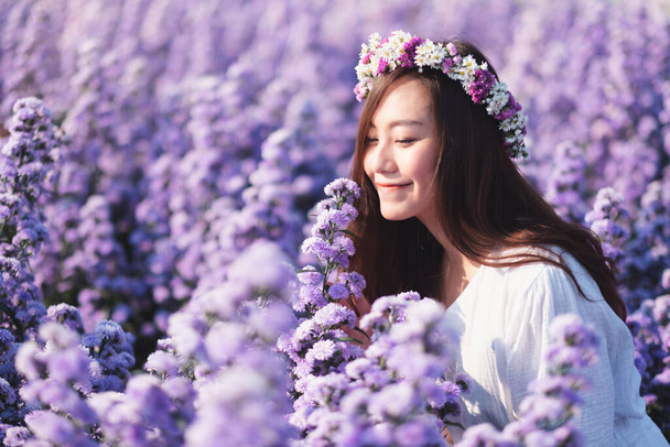 Portrait image of an asian woman in a beautiful Margaret flower field - Photo, Image