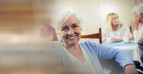 Blur effect with copy space against caucasian senior woman smiling at retirement home. retirement home and living concept - Foto, immagini