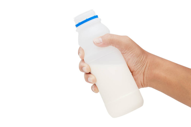 Botella de mano de leche aislada sobre fondo blanco - caminos de recorte - Foto, Imagen