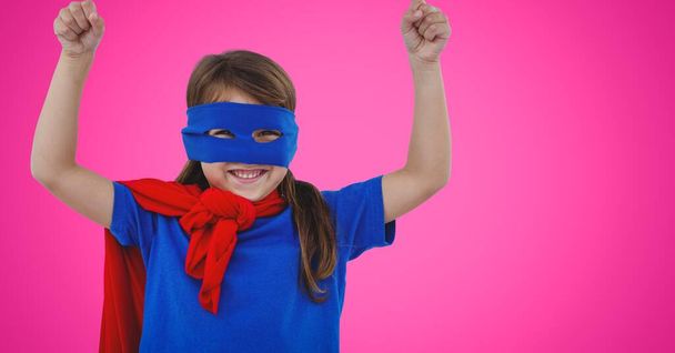 Portrait of caucasian girl in superhero costume against copy space on pink background. women empowerment concept - Φωτογραφία, εικόνα