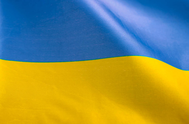 Flag of Ukraine. Blue and yellow colors. Close up shot, background - Φωτογραφία, εικόνα