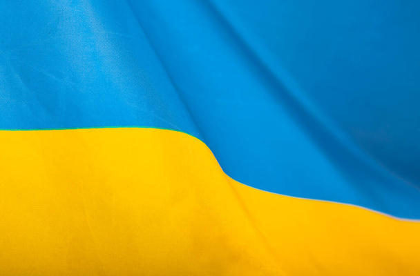 Flag of Ukraine. Blue and yellow colors. Close up shot, background - Foto, Imagem