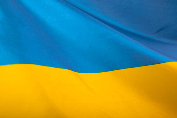 Flag of Ukraine. Blue and yellow colors. Close up shot, background - Foto, afbeelding