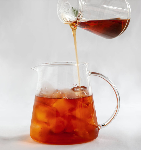 pouring iced tea into glass jag - Фото, изображение
