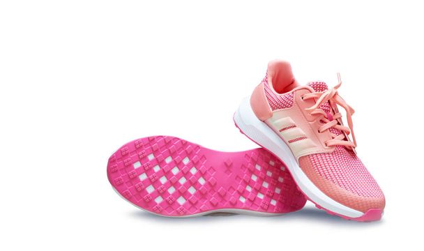 rózsaszín sport cipő cipő talp alapja fehér elszigetelt háttér - Fotó, kép