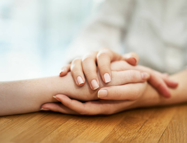 Offering support and comfort. Shot of two people holding hands in comfort. - Foto, Bild