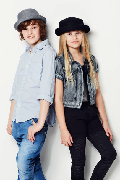 Never too young to look trendy. Portrait of two young kids posing in studio. - Φωτογραφία, εικόνα
