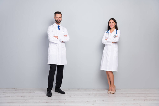 Full length body size view of two attractive successful cheery medics folded arms career isolated on grey color pastel background - Fotoğraf, Görsel