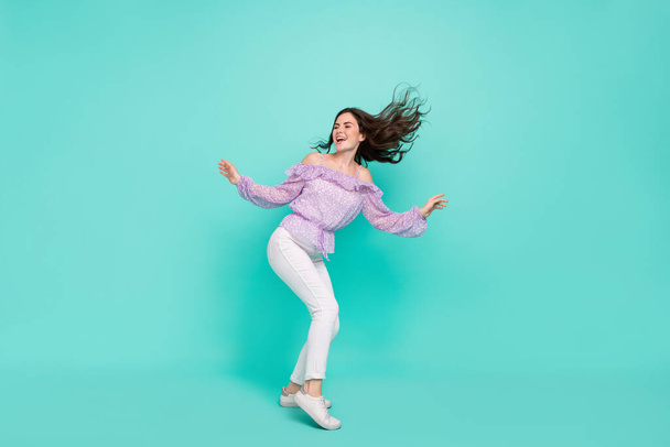 Full length body size view of attractive cheerful dreamy girl dancing having fun isolated over bright blue color background - Foto, immagini