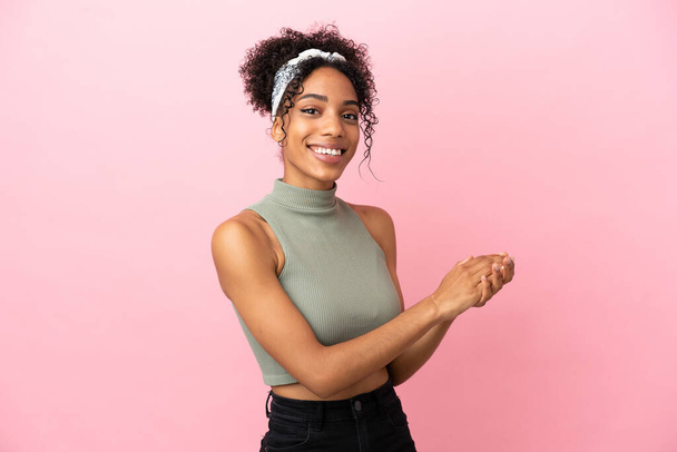 Young latin woman isolated on pink background applauding - Photo, Image