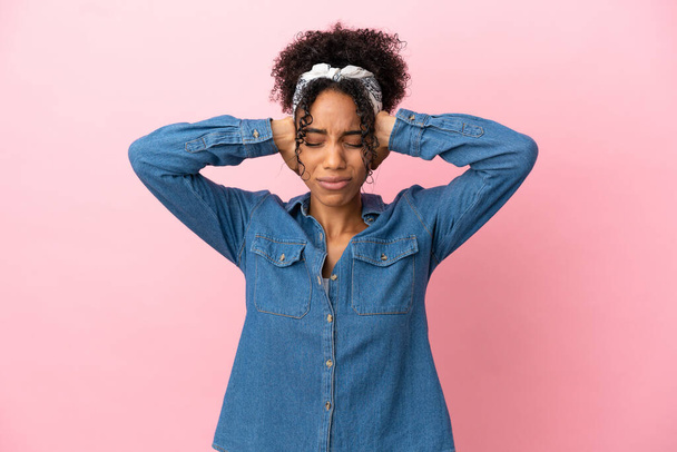 Young latin woman isolated on pink background frustrated and covering ears - Photo, Image