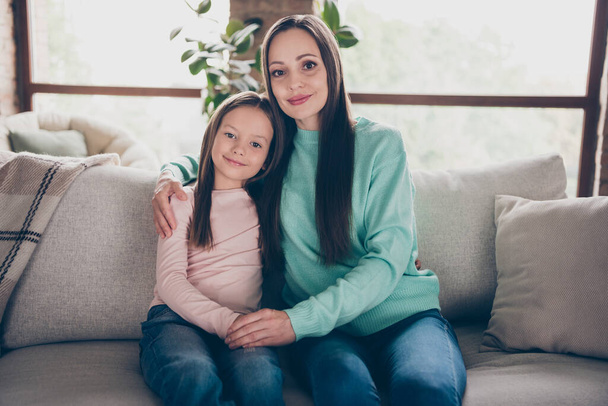 Photo of family bonding lady hands embrace small adorable girl wear casual outfit in comfortable home indoors - Zdjęcie, obraz