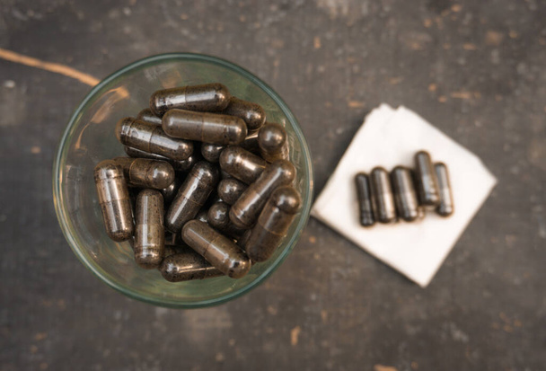 (habbatussauda) black cumin in capsules. body supplements. - Photo, Image