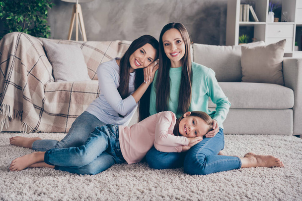 Portrait of attractive cute gentle careful cheerful family bonding cuddling resting pastime staying safe at home indoors - Fotografie, Obrázek