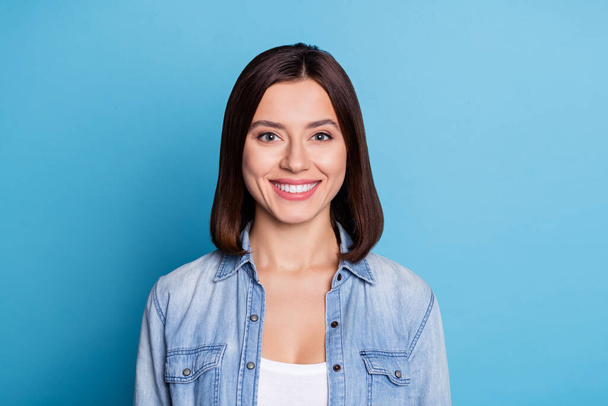 Portrait of satisfied candid girl toothy beaming smile look camera isolated on pastel blue color background - Zdjęcie, obraz