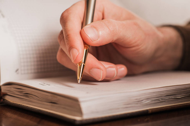 businessman writes in a notebook, routine, business plan  - Foto, Bild