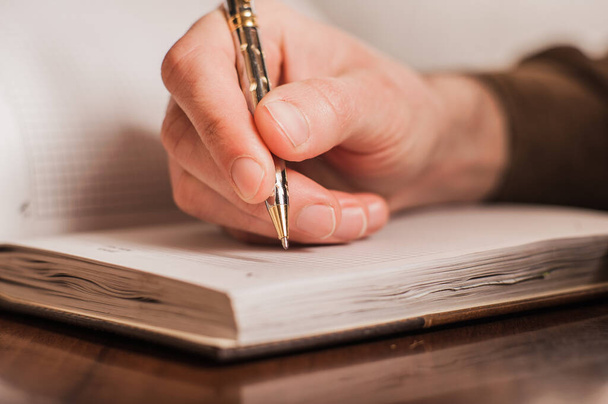 businessman writes in a notebook, routine, business plan  - Zdjęcie, obraz