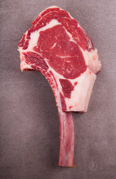 cut raw meat prime rib top view in butcher shop - Foto, Imagen