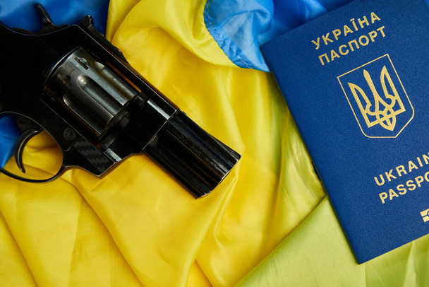 Flag of Ukraine, handgun, passport copy space, russia Ukraine war, Stop war, Freedom, independence countr - Photo, Image
