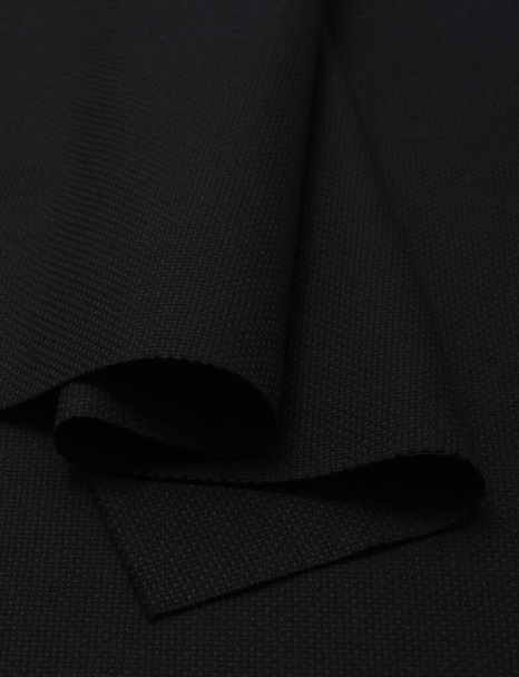 Текстура вышивки. Черный чистый холст с складками в качестве фона - Фото, изображение