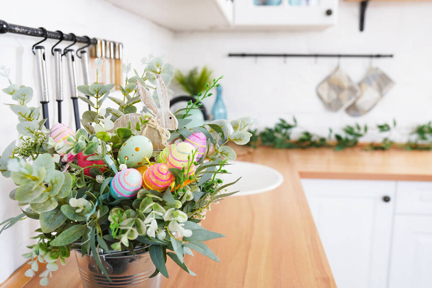 Easter bouquet and eggs on the table In white Scandinavian-style kitchen. Beautiful greeting card. The minimal concept - Fotografie, Obrázek