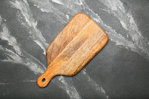 Cutting board on stone kitchen table.  top view - Photo, Image