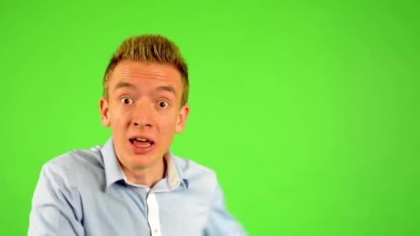 Man - green screen - portrait - man welcomes people - man invites people with hands - Footage, Video