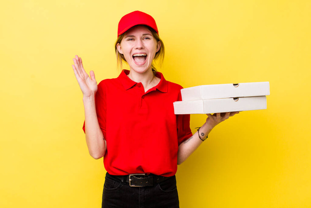 red head pretty woman feeling happy and astonished at something unbelievable. delivery pizza concept - Фото, зображення
