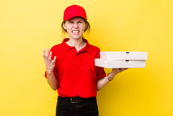 red head pretty woman looking angry, annoyed and frustrated. delivery pizza concept - Fotoğraf, Görsel