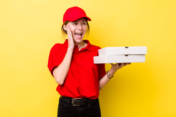 red head pretty woman feeling happy, excited and surprised. delivery pizza concept - Foto, imagen