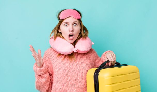 red head pretty woman feeling extremely shocked and surprised. flight passenger concept - 写真・画像