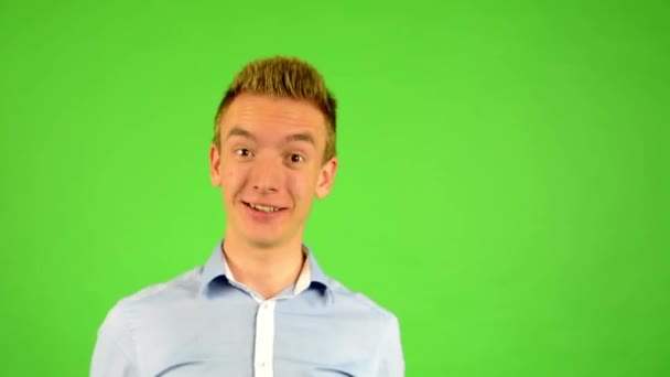 Man - green screen - portrait - man welcomes people - man invites people with hands - Materiał filmowy, wideo