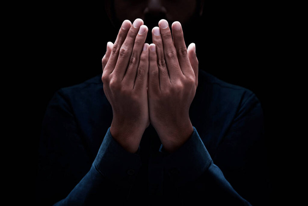 Muslim man praying on dark background - Fotoğraf, Görsel