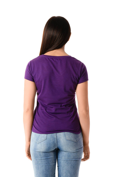 Young woman in purple t-shirt on white background, back view - Photo, image