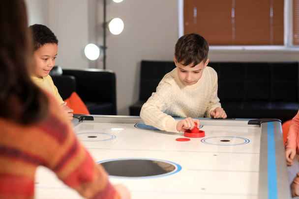 Little children playing air hockey indoors - Photo, Image