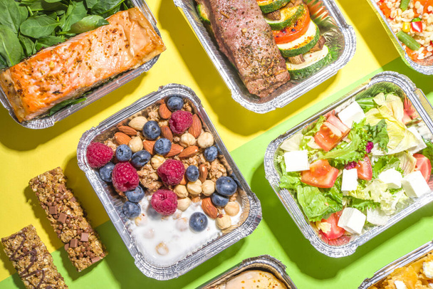 Healthy catering menu, courier food delivery lunch boxes. Beef steak meat, chicken filet , fish and vegetables in packages. Daily meal diet plan delivery , take away containers, online order concept - Photo, Image