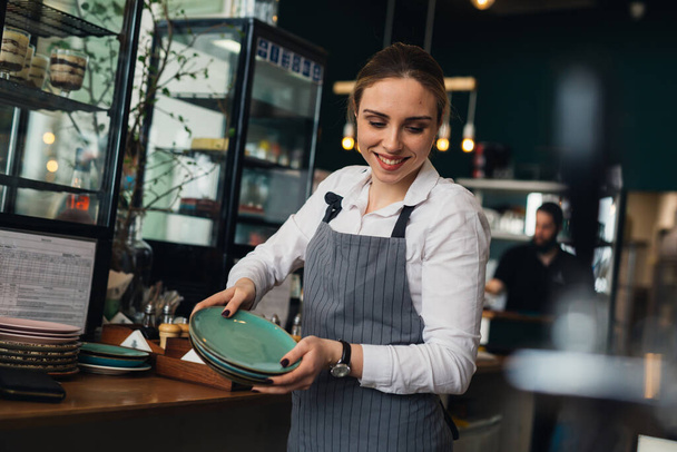 woman waitress working in restaurant - Foto, Imagem