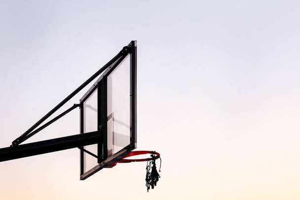 basketball hoop with the sky in the background, concept of urban sport outdoors, copy space for text - Fotó, kép