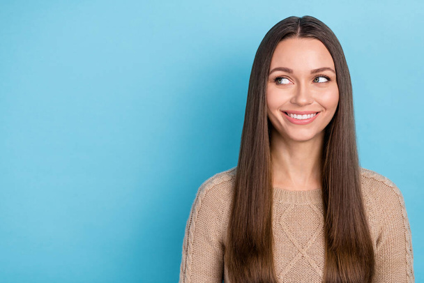 Portrait of attractive cheerful long-haired girl looking aside thinking copy blank space isolated over bright blue color background - Foto, Imagen